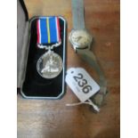 An Eterna Matic watch and National Service medals