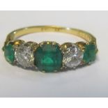 A gold five stone emerald and diamond ring, 2.6g size L
