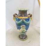 A majolica vase with antlered lion and cherubs (base restored)