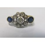 A diamond cluster ring with two sapphires, 3.1g size T