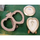 A double sterling silver heart shaped frame, another heart shaped frame and a circular one