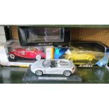 A Porsche Carrera GT model car, a Solido Volkswagen Beetle (both boxed) and a Maisto Mercedes Benz
