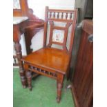A pair of oak hall chairs with tile backs