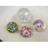 A large bubble glass paperweight and other paperweights