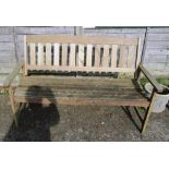 A wooden slatted garden bench