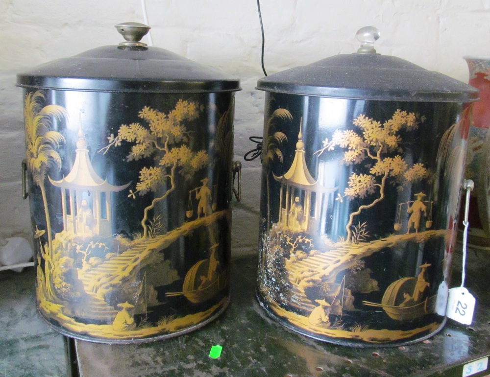 Two black oriental style coal bins different knops