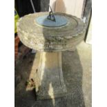 A sundial on stoneware pedestal