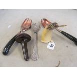 Two pairs salad servers, horn penguin and a sewing mushroom