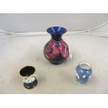 An enamel Moorcroft penguin eggcup and snowdrop vase and anemone vase