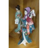 A bisque pottery figure geisha and another with hobby horse head (hand missing)