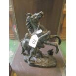A Marley black coated Spelter horse and groom