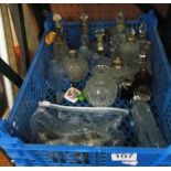 Various scent bottles some with silver collars and some spare lids