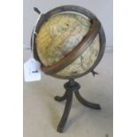 A small globe in metal stand