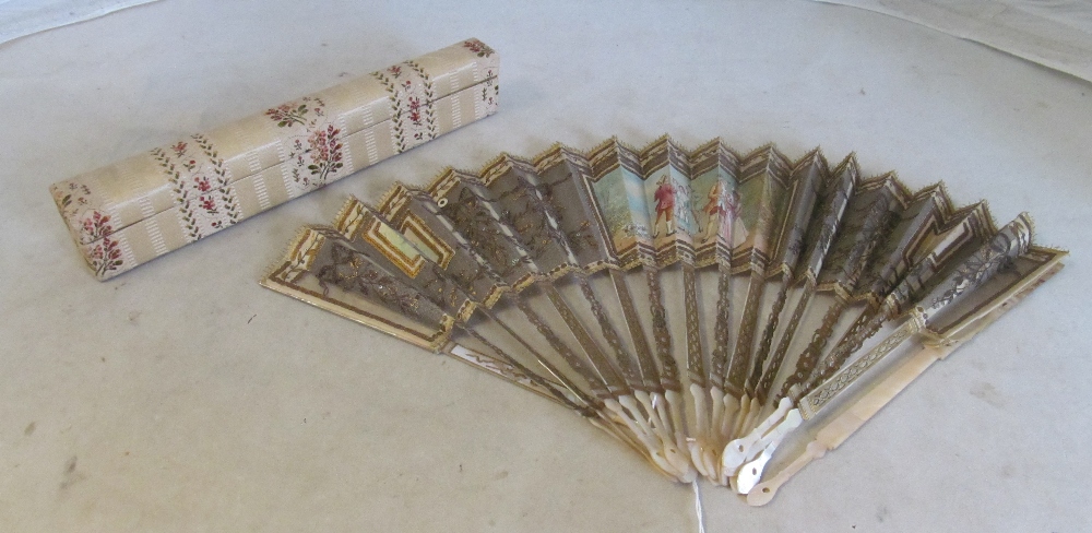 A 19th Century fan with painted scene of courting couples and sequin design on mother of pearl