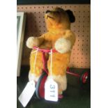 A Chiltern bear riding a tricycle designed by Pamela Howells Circa 1958