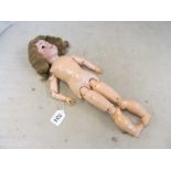 An Armand Marseille doll marked DRGM A 1 1/2 (no eyes)