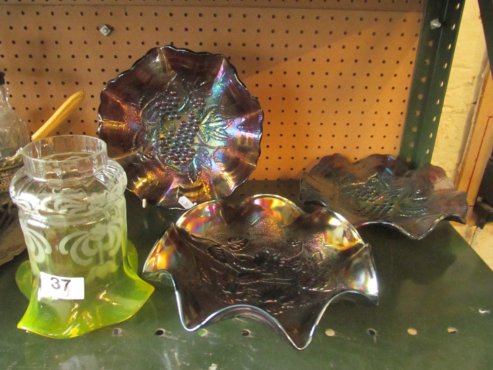 A glass shade and three carved glass dishes