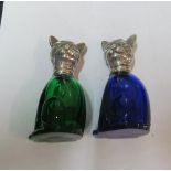 Two white metal cat condiments with glass bodies