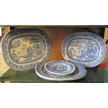 Four large blue and white meat plates and three other plates