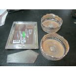 A silver frame and pair plated wine coasters