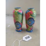 A pair of Clarice Cliff small vases