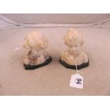 An alabaster model of boy's head (a/f) and alabaster model of girl's head