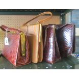 Three crocodile effect handbags and a Holmes ostrich handbag