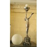 An Art Deco style silver coloured lamp lady balancing a spherical shade