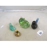 A Wedgwood paperweight blue bird, another green frog and Isle of Wight two small birds