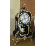 A French style clock blue porcelain case with gilt mounts, painted dial and scenes to the sides of