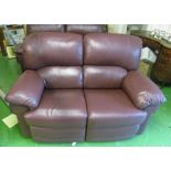 A pair of brown recliner two seater settees