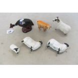 A Royal Doulton Flambé Guinea Fowl (slightly a/f), three Beswick sheep (three a/f) and a Ram and a