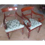 A pair of 19th Century mahogany elbow chairs