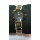 A Jacques Leman black and gilt watch (boxed)