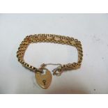 A 15ct gold gate bracelet and padlock 22g