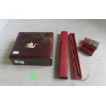 An oriental box decorated cranes, red lacquer box with chopsticks and another box