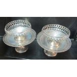 A pair of silver pedestal dishes and a pair of silver pierced bowls