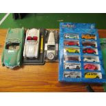 Three model cars and twelve cars in box