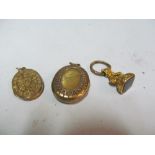 Two lockets and a seal