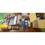 Two boxes of play worn toys and other vehicles