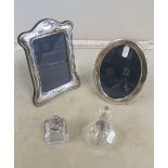 Two silver photo frames, inkwell and scent bottle