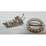 A 9ct white gold fern brooch set pearls and a gold and pearl oval brooch