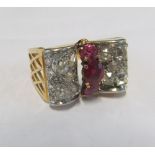 An 18ct gold Art Deco style diamond and ruby ring 8.4g