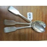 Three silver serving spoons