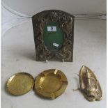 An oriental metal frame embossed dragon and a small group of brass