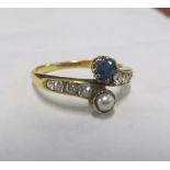 An 18ct gold sapphire and diamond crossover ring 2.9g