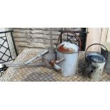 Three galvanised watering cans