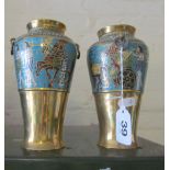 A pair of Egyptian revival brass vases decorated bands of figures