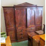 A large 19th Century mahogany wardrobe with cornice, two central doors and two short and two long
