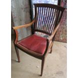 A slat back Edwardian chair